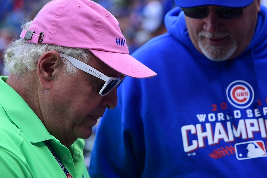 who is the guy in the pink hat at cubs games